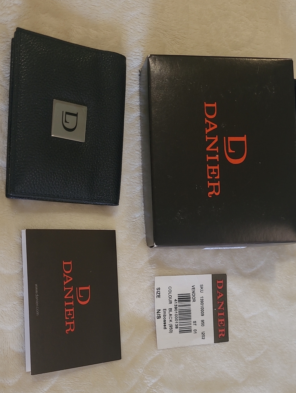 Danier Black Pebble Leather Bifold Wallet with Metal Logo Plate